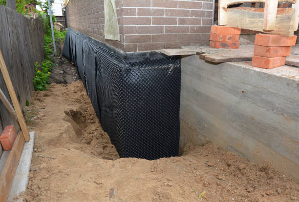 Happy homeowners after waterproofing job in Rockaway